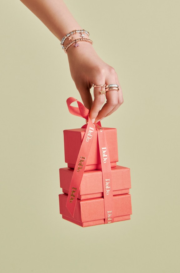 Hand Holding Gift Boxes