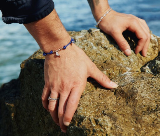 Hands Resting On A Stone