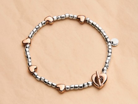 A Jewelry Box With The Charms M, Heart, M In It